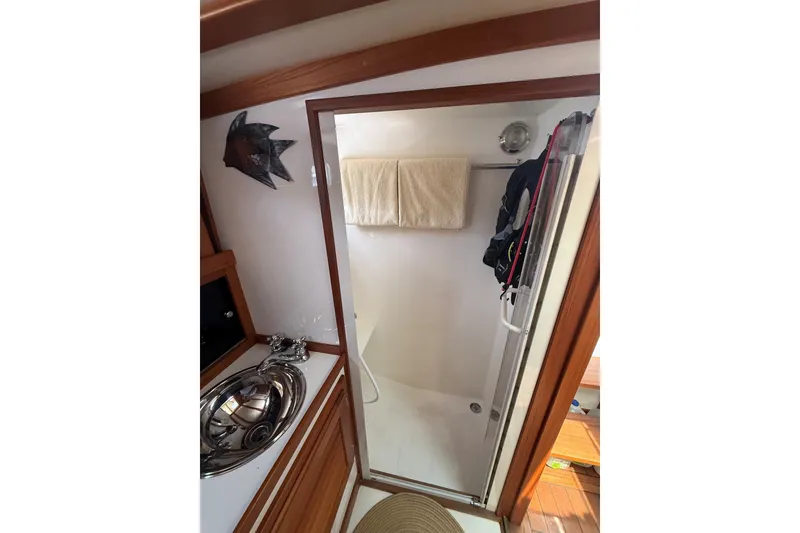 Slide: The Image of Bathroom interior of 2003 Ellis 36 Express Cruiser with shower and sink. - 32