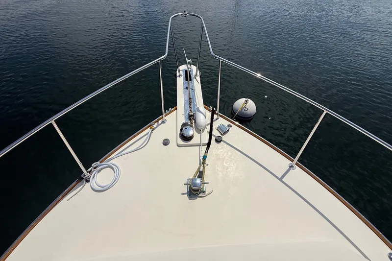 Slide: The Image of Bow view of 2003 Ellis 36 Express Cruiser on calm water. - 7