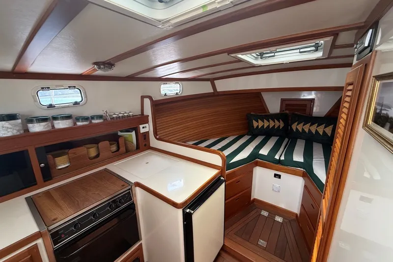 Slide: The Image of Interior of 2003 Ellis 36 Express Cruiser with cozy bed and compact kitchen area. - 21