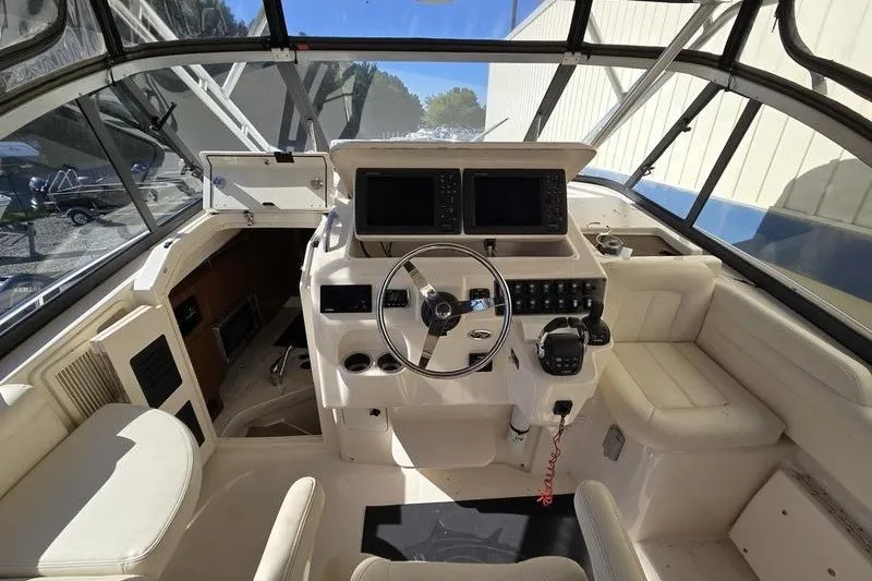 Slide: The Image of 2017 Grady-White Express 330 helm with dual displays and comfortable seating. - 18