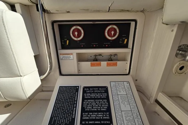 Slide: The Image of Control panel of a 2017 Grady-White Express 330 boat with battery switches. - 23