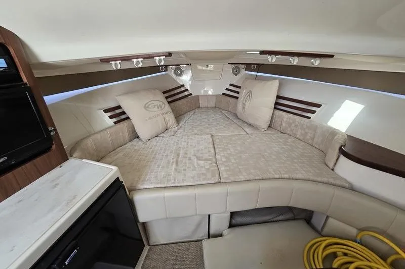 Slide: The Image of 2017 Grady-White Express 330 cabin interior with cozy seating and cushions. - 21