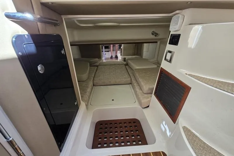 Slide: The Image of 2017 Grady-White Express 330 cabin interior with cushioned seating and modern amenities. - 26