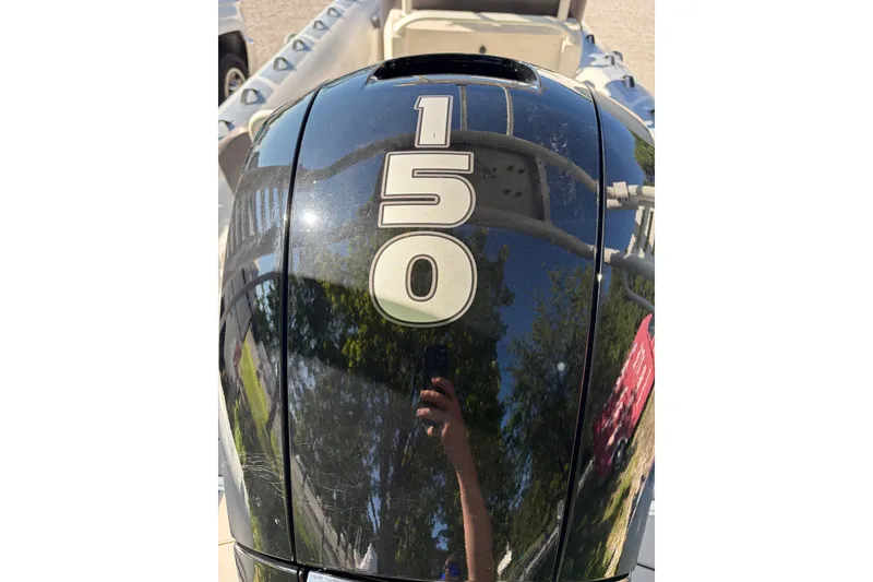 Slide: The Image of Outboard motor with "150" on a 2024 Highfield Sport 660 boat. - 20