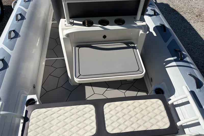 Slide: The Image of 2024 Highfield Sport 660 boat interior with seating and storage compartments. - 15