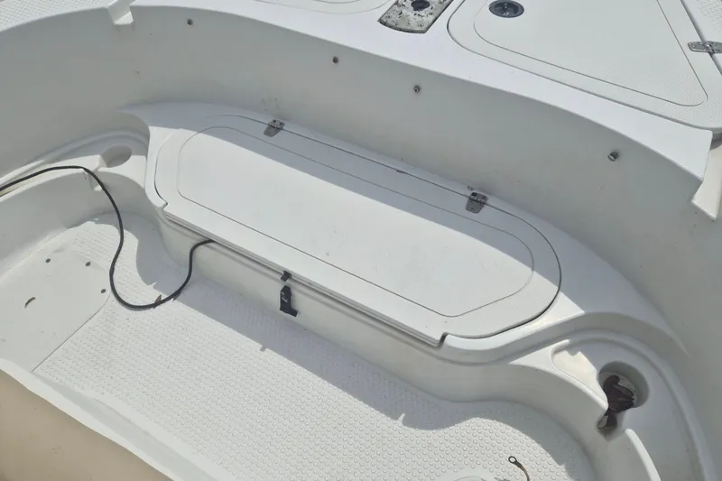 Slide: The Image of Interior view of a 2007 Triumph 190 Bay boat, featuring storage compartments. - 18