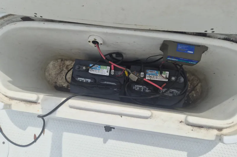 Slide: The Image of Battery compartment of a 2007 Triumph 190 Bay boat with wiring and connections. - 19