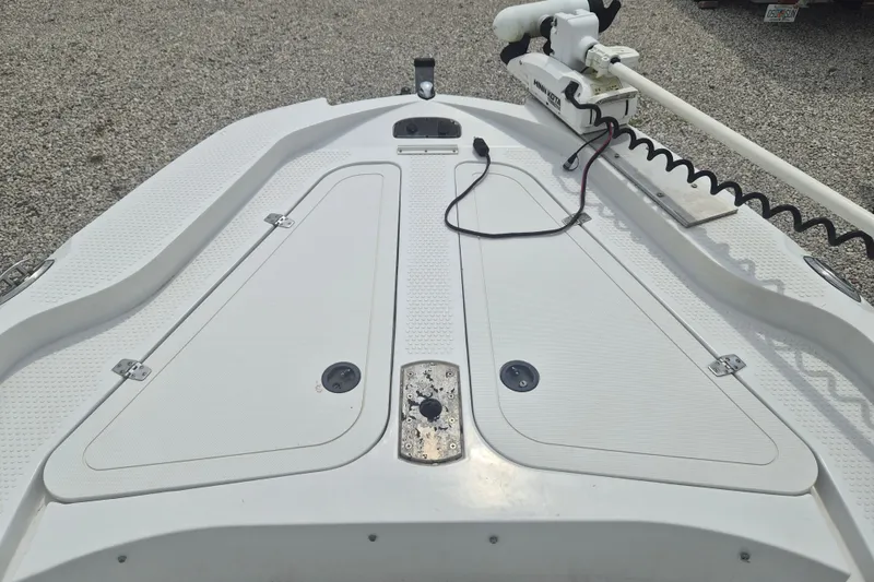 Slide: The Image of 2007 Triumph 190 Bay boat deck with trolling motor and storage compartments. - 20