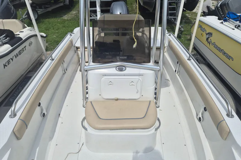 Slide: The Image of 2007 Triumph 190 Bay boat interior with beige seating and center console. - 16