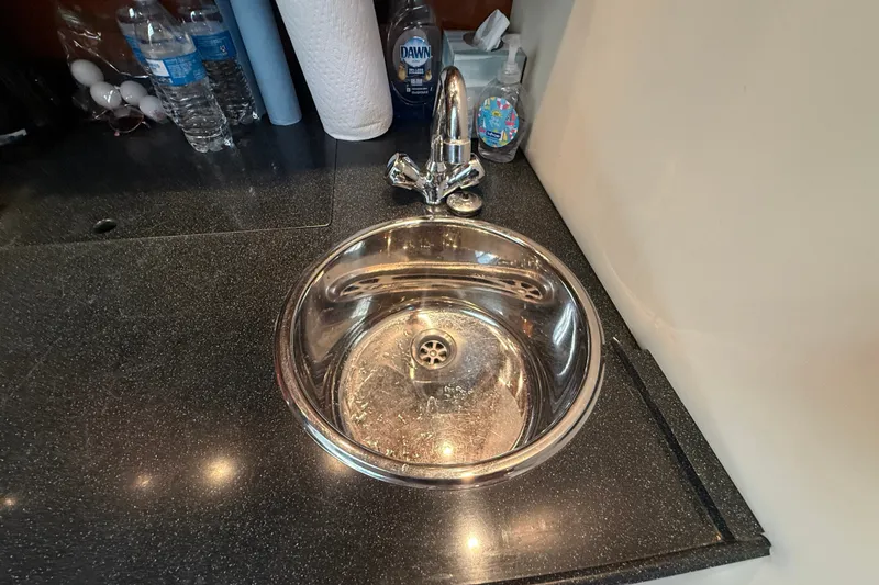 Slide: The Image of Stainless steel sink on Regal Commodore 3560 IO yacht, 2005 model, with countertop essentials. - 44