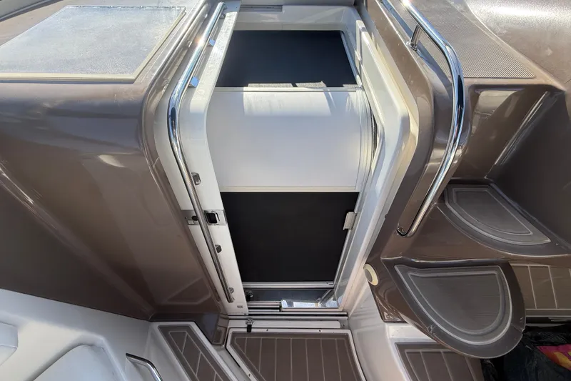 Slide: The Image of 2005 Regal Commodore 3560 IO boat interior with open hatch and sleek design. - 32
