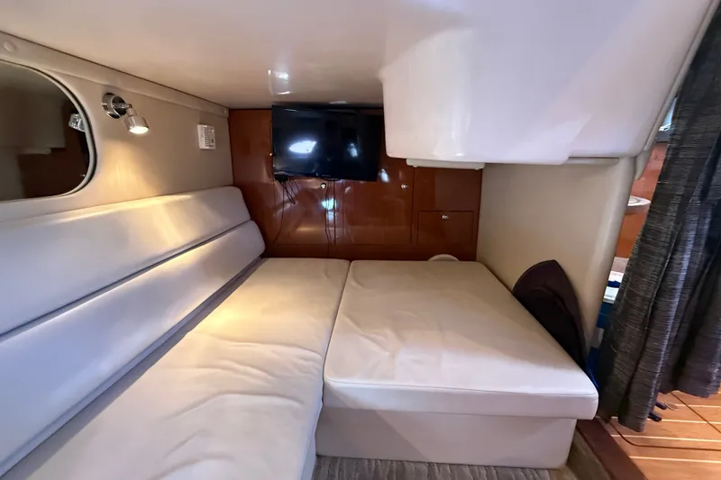 Slide: The Image of Interior cabin of 2005 Regal Commodore 3560 IO yacht with sofa and TV. - 60