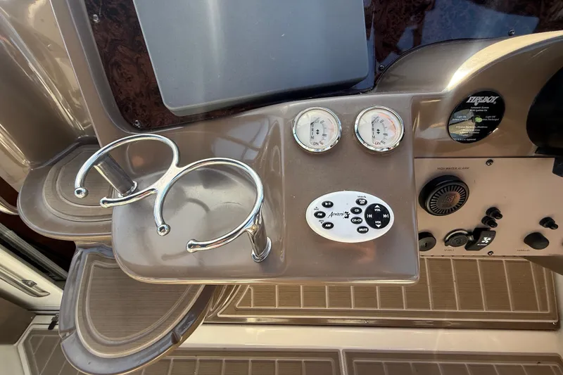 Slide: The Image of Control panel of a 2005 Regal Commodore 3560 IO boat with gauges and controls. - 27