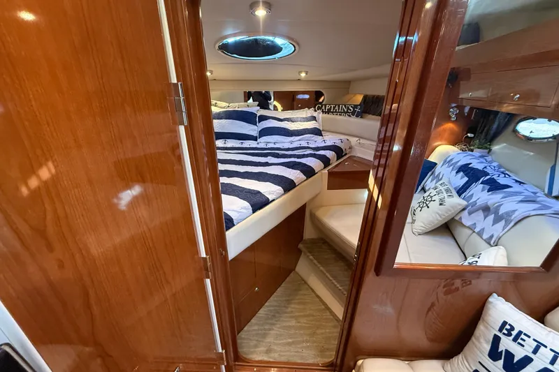 Slide: The Image of Luxurious cabin interior of 2005 Regal Commodore 3560 IO yacht with cozy bedding. - 48