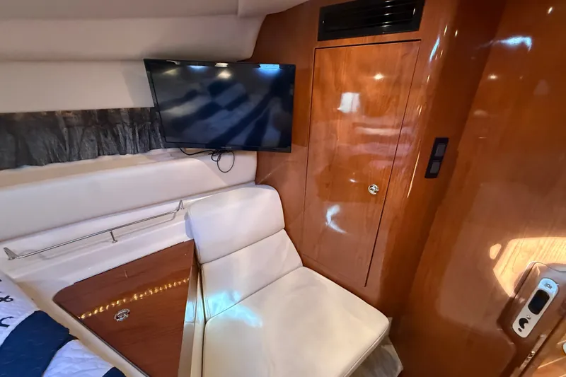 Slide: The Image of Luxurious interior of 2005 Regal Commodore 3560 IO yacht with TV and seating. - 52