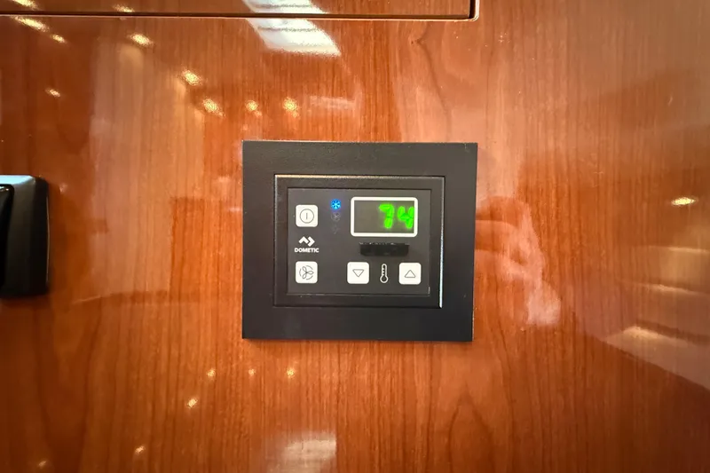 Slide: The Image of Digital control panel on 2005 Regal Commodore 3560 IO yacht interior. - 62