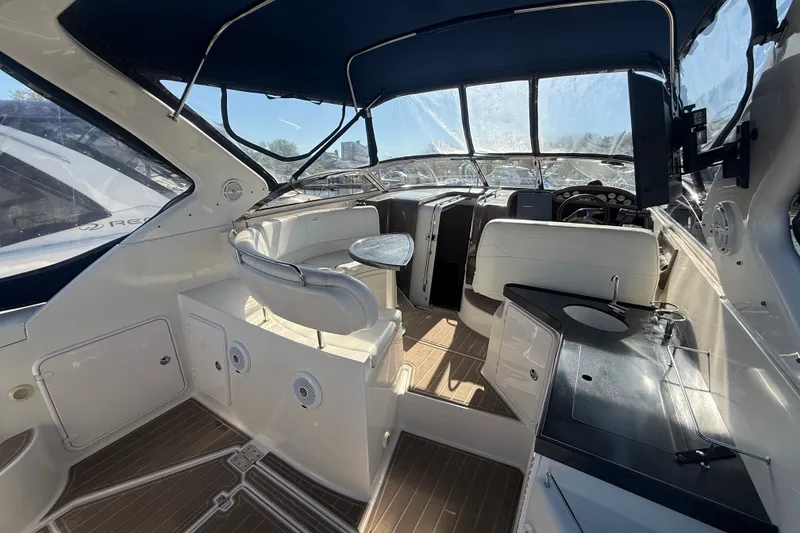 Slide: The Image of Interior of a 2005 Regal Commodore 3560 IO yacht with seating and helm. - 9