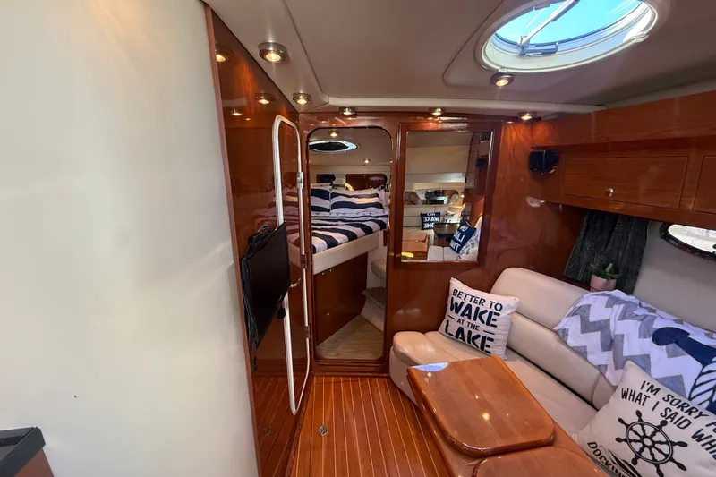 Slide: The Image of Luxurious interior of 2005 Regal Commodore 3560 IO yacht with cozy seating and stylish decor. - 38