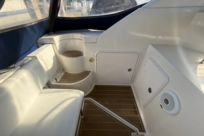 Slide: The Image of Interior of 2005 Regal Commodore 3560 IO boat, featuring seating and storage compartments. - 12