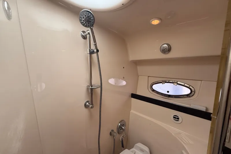 Slide: The Image of Luxurious bathroom in 2005 Regal Commodore 3560 IO yacht with shower and porthole window. - 56