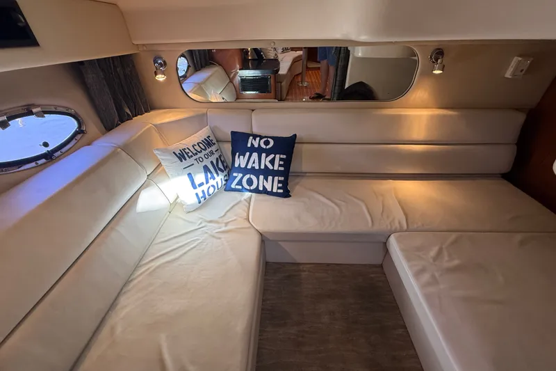 Slide: The Image of Interior of 2005 Regal Commodore 3560 IO yacht with cozy seating and decorative pillows. - 59
