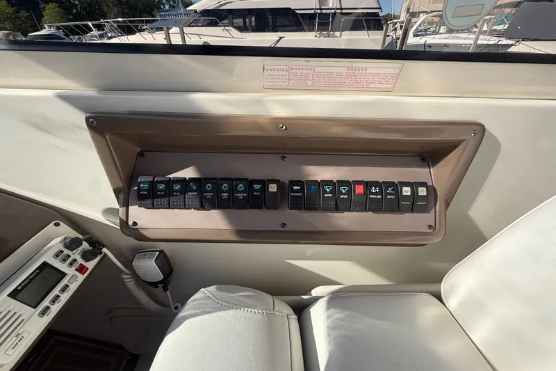 Slide: The Image of Control panel of a 2005 Regal Commodore 3560 IO boat with labeled switches. - 30