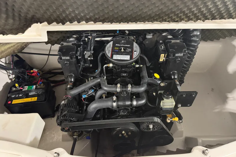 Slide: The Image of Engine compartment of a 2010 Tahoe Q5i Sport boat with MerCruiser 4.3L engine. - 12