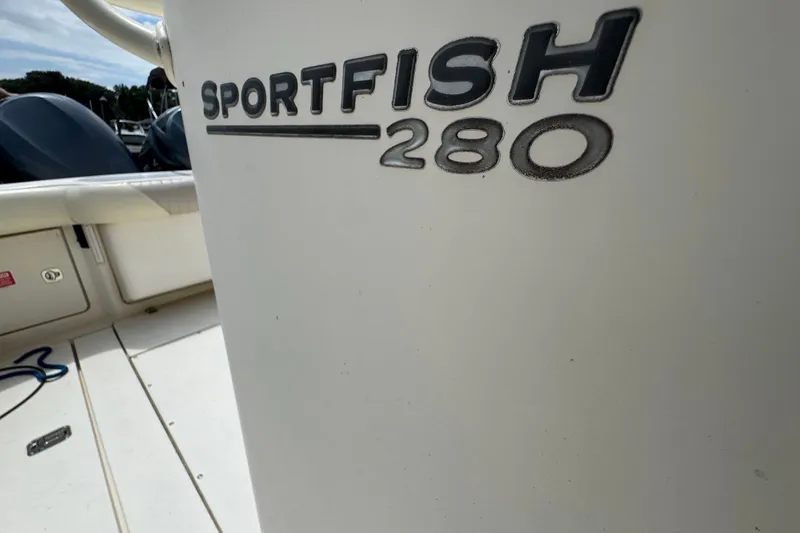 Slide: The Image of 2003 Scout 280 Sportfish boat interior with logo detail. - 17