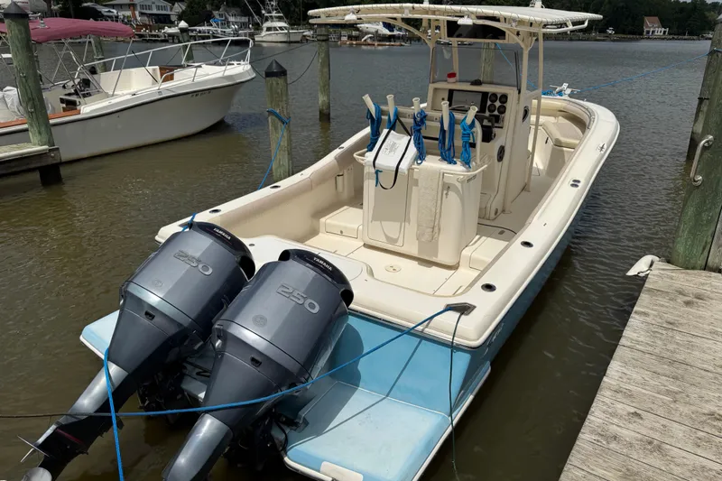 Slide: The Image of 2003 Scout 280 Sportfish boat docked with twin Yamaha 250 engines. - 1