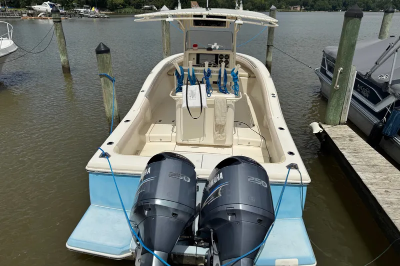 Slide: The Image of 2003 Scout 280 Sportfish boat docked with dual Yamaha 250 engines. - 2