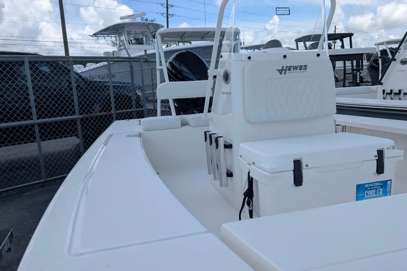 Slide: The Image of A white boat with a center console and an Engel cooler on the deck. - 16