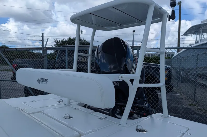 Slide: The Image of The image shows a boat with a white seat and an outboard motor. - 9