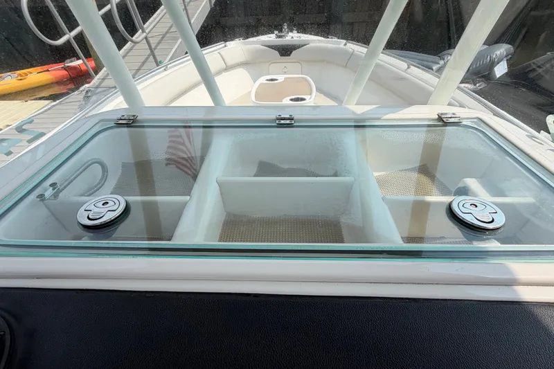 Slide: The Image of 2022 Sailfish 242 CC boat with glass compartment and deck view. - 16