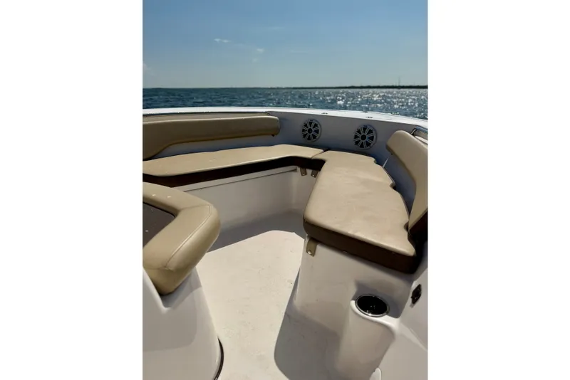Slide: The Image of 2022 Tidewater 1910 Bay Max boat interior with beige seating, ocean view. - 29