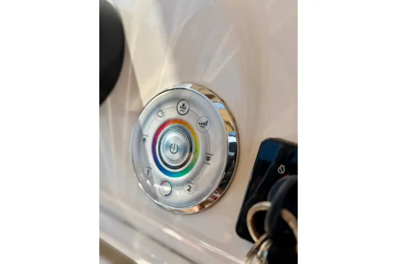 Slide: The Image of Control panel of 2022 Tidewater 1910 Bay Max boat with colorful buttons and key ignition. - 28