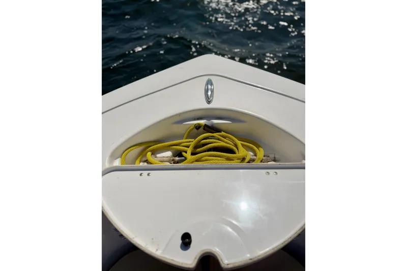 Slide: The Image of Bow of 2022 Tidewater 1910 Bay Max boat with yellow rope on deck. - 27