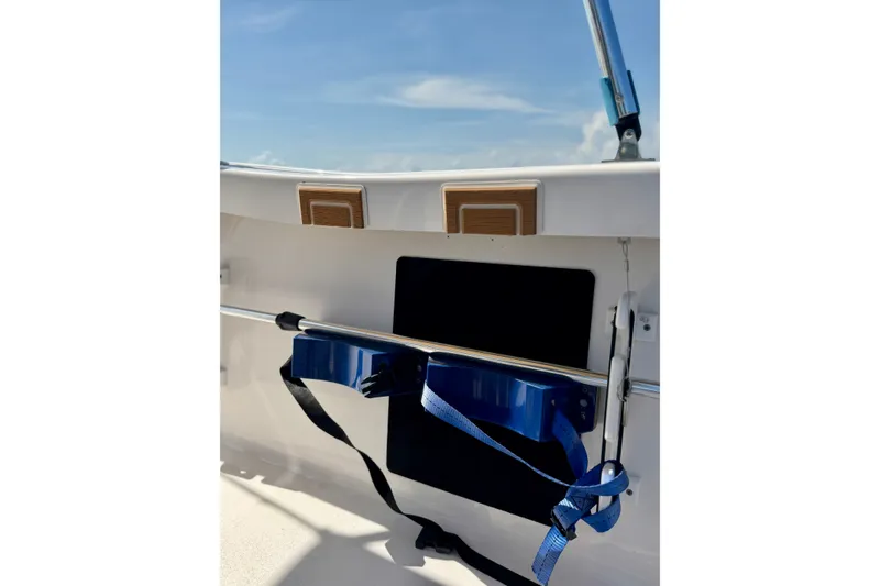 Slide: The Image of Interior view of a 2022 Tidewater 1910 Bay Max boat under a clear blue sky. - 14