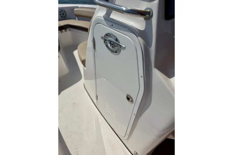 Slide: The Image of 2022 Tidewater 1910 Bay Max boat console with storage compartment and stainless steel handle. - 25