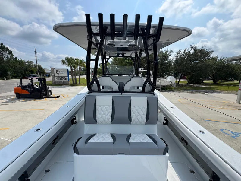 Slide: The Image of 2027 Yellowfin 34 Offshore boat with sleek seating and modern design in a sunny outdoor setting. - 41