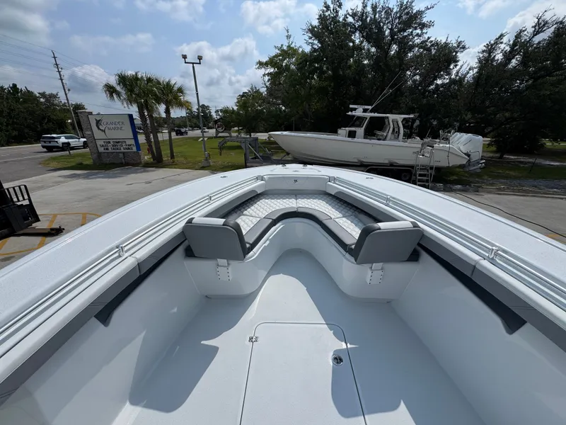 Slide: The Image of 2027 Yellowfin 34 Offshore boat with spacious seating, parked at Grandeur Marine. - 22