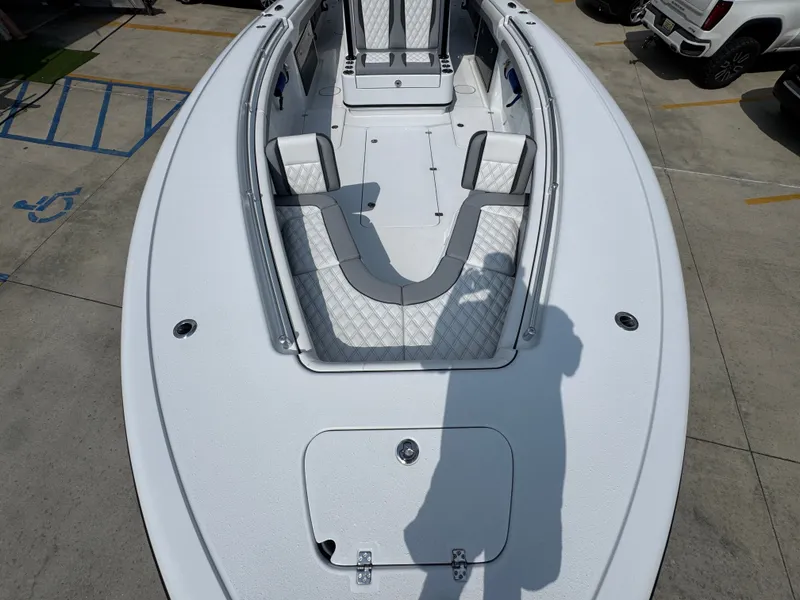 Slide: The Image of 2027 Yellowfin 34 Offshore boat with spacious deck and cushioned seating. - 24