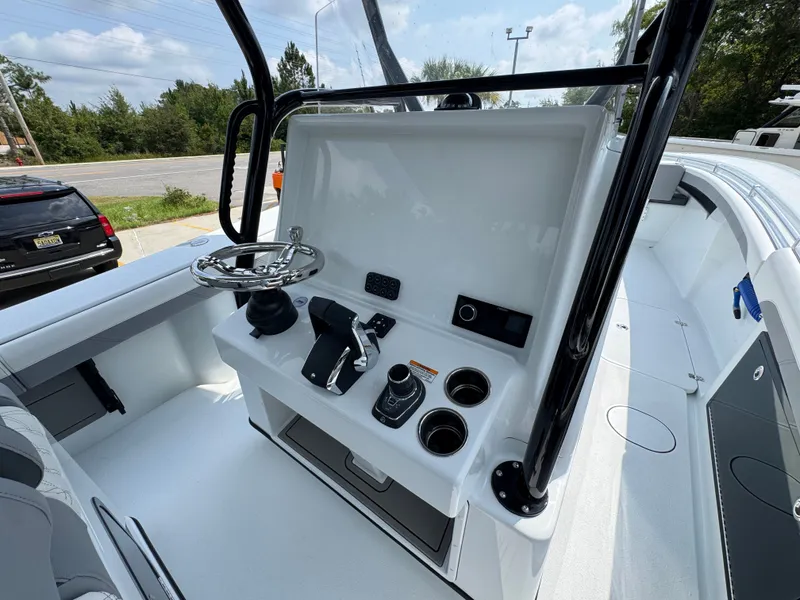 Slide: The Image of 2027 Yellowfin 34 Offshore boat console with steering wheel and controls. - 39