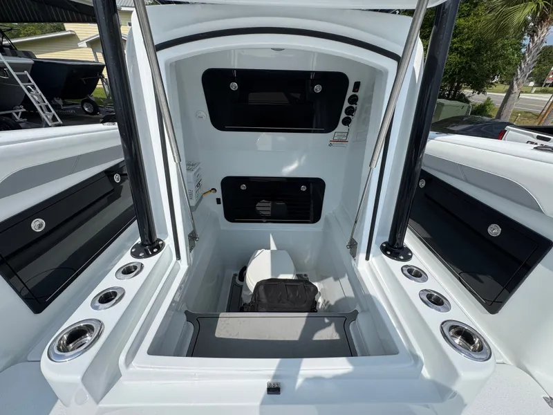 Slide: The Image of 2027 Yellowfin 34 Offshore boat interior with storage compartments and rod holders. - 27