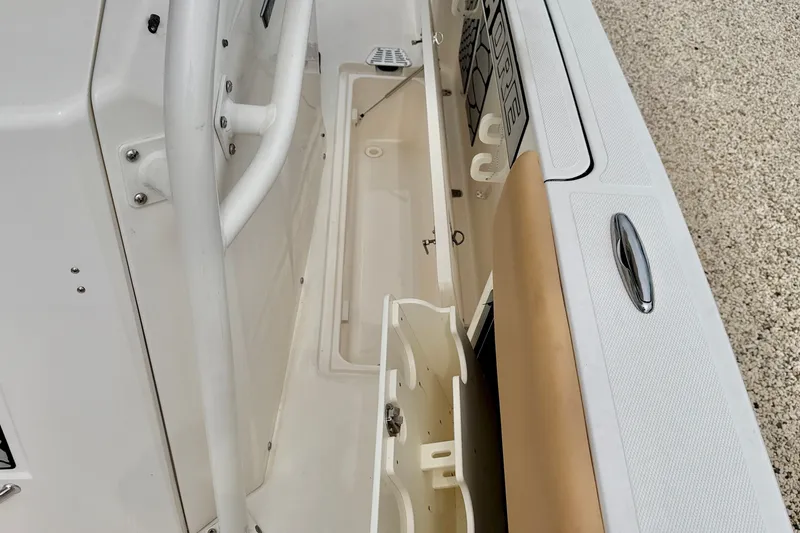 Slide: The Image of 2019 Wellcraft 262 Fisherman boat interior storage compartment detail. - 33