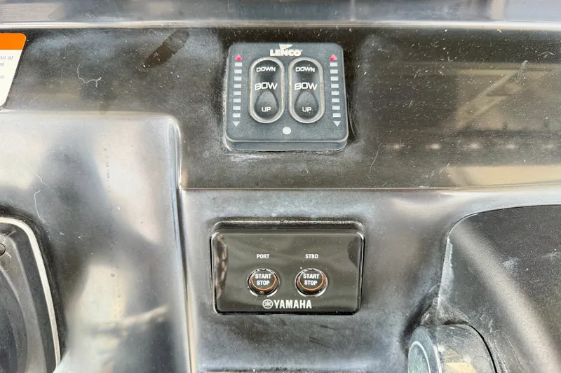 Slide: The Image of Control panel of a 2019 Wellcraft 262 Fisherman boat with Yamaha start/stop buttons. - 16