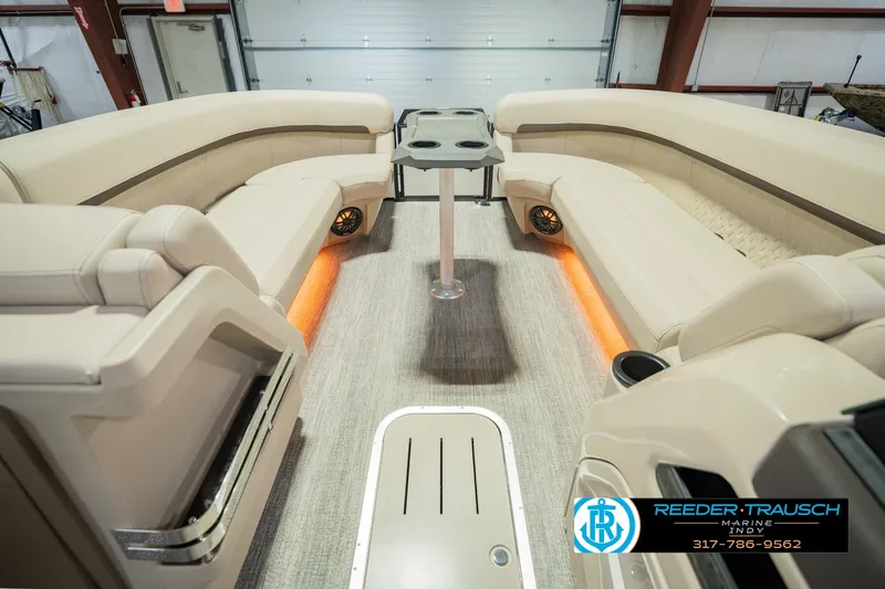 Slide: The Image of Luxurious interior of 2026 Bennington 24 MSB pontoon boat with plush seating and ambient lighting. - 25
