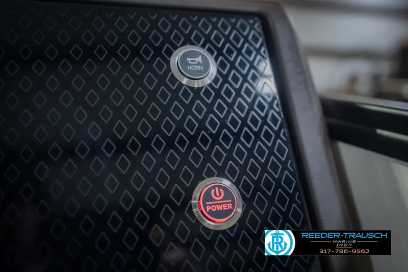 Slide: The Image of Control panel of 2026 Bennington 24 MSB boat with horn and power buttons. - 44