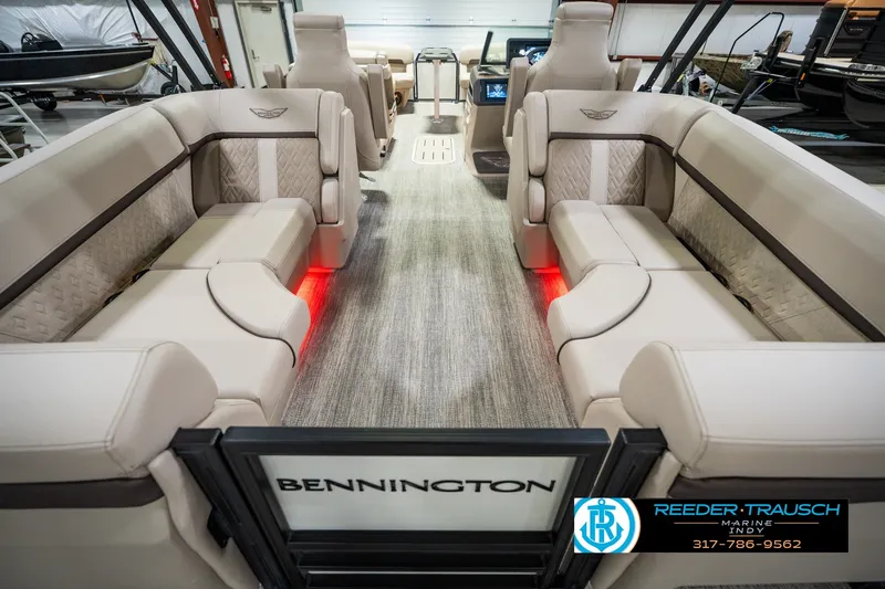 Slide: The Image of 2026 Bennington 24 MSB pontoon boat interior with luxurious seating and ambient lighting. - 22