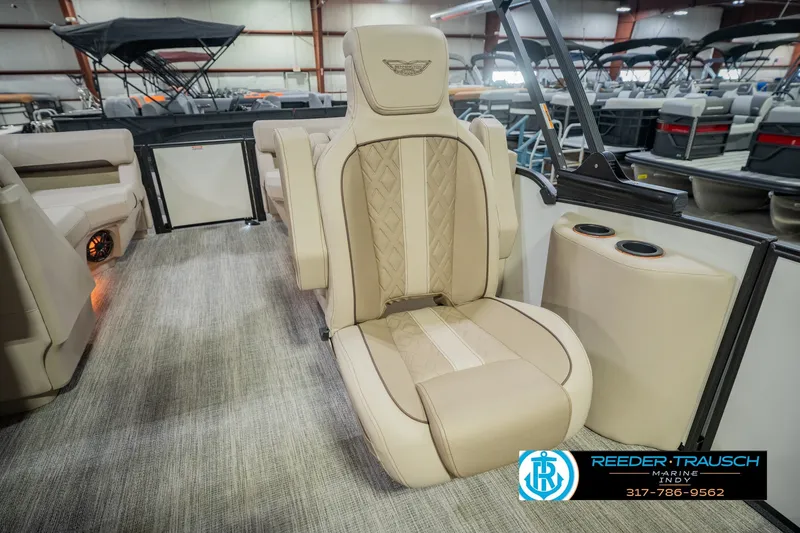 Slide: The Image of Luxurious seating on a 2026 Bennington 24 MSB pontoon boat, featuring elegant beige upholstery. - 48