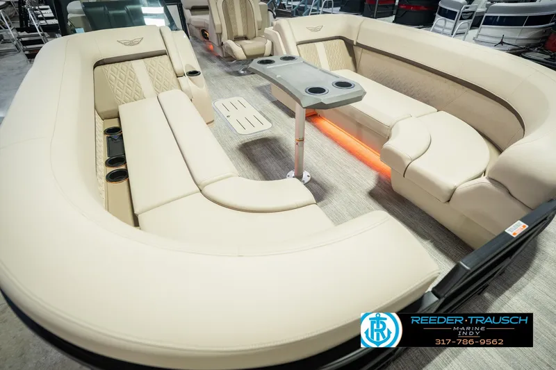 Slide: The Image of Luxurious seating on 2026 Bennington 24 MSB pontoon boat with beige upholstery and cup holders. - 14